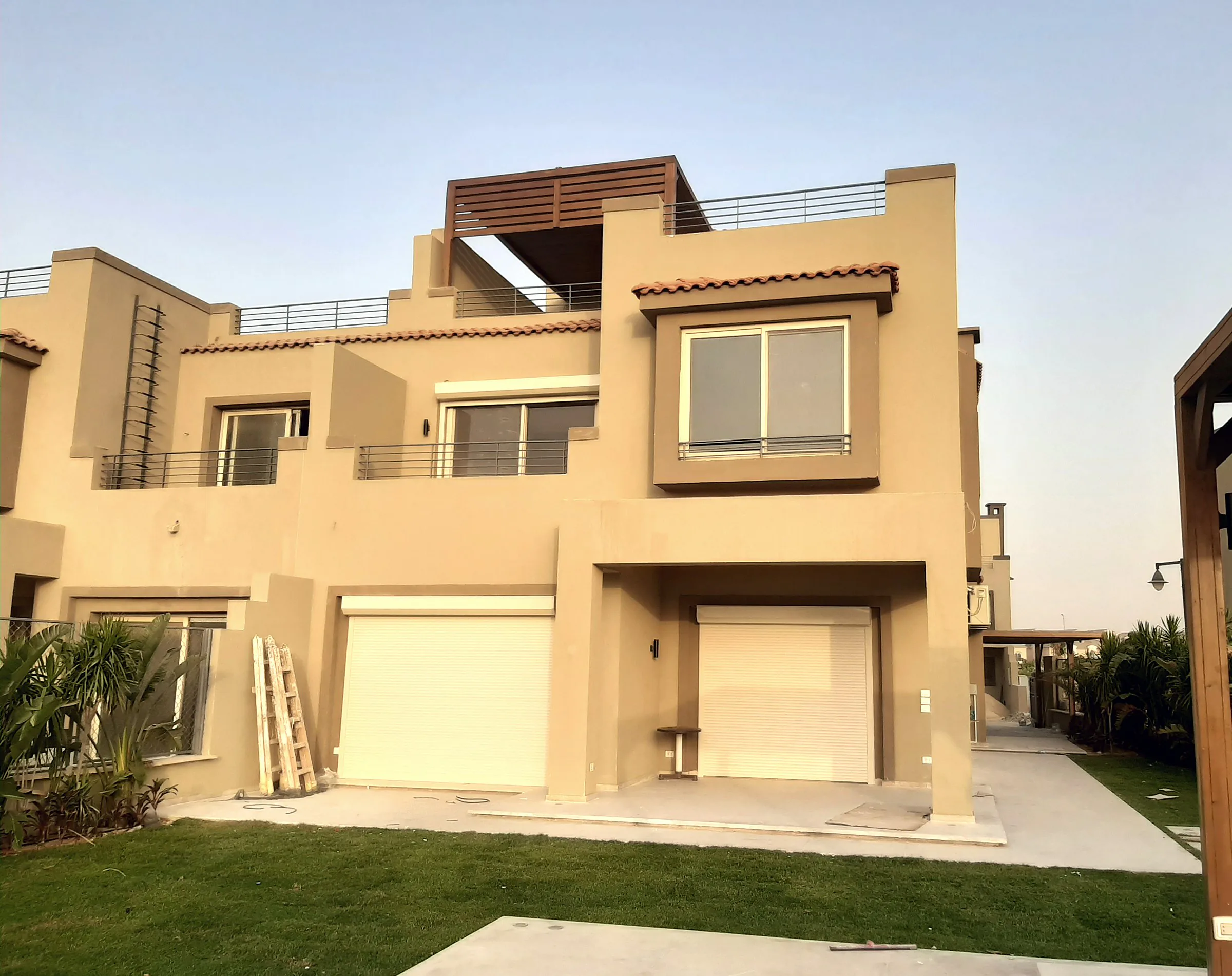 Modern villa with its ground-floor roller shutters down