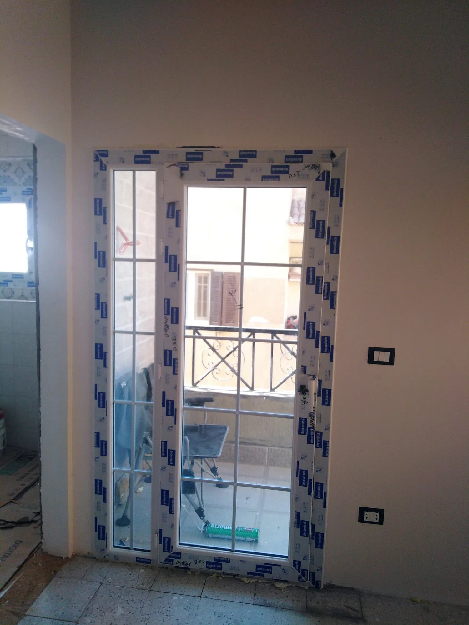 Balcony door with classic glazing bars and a side light